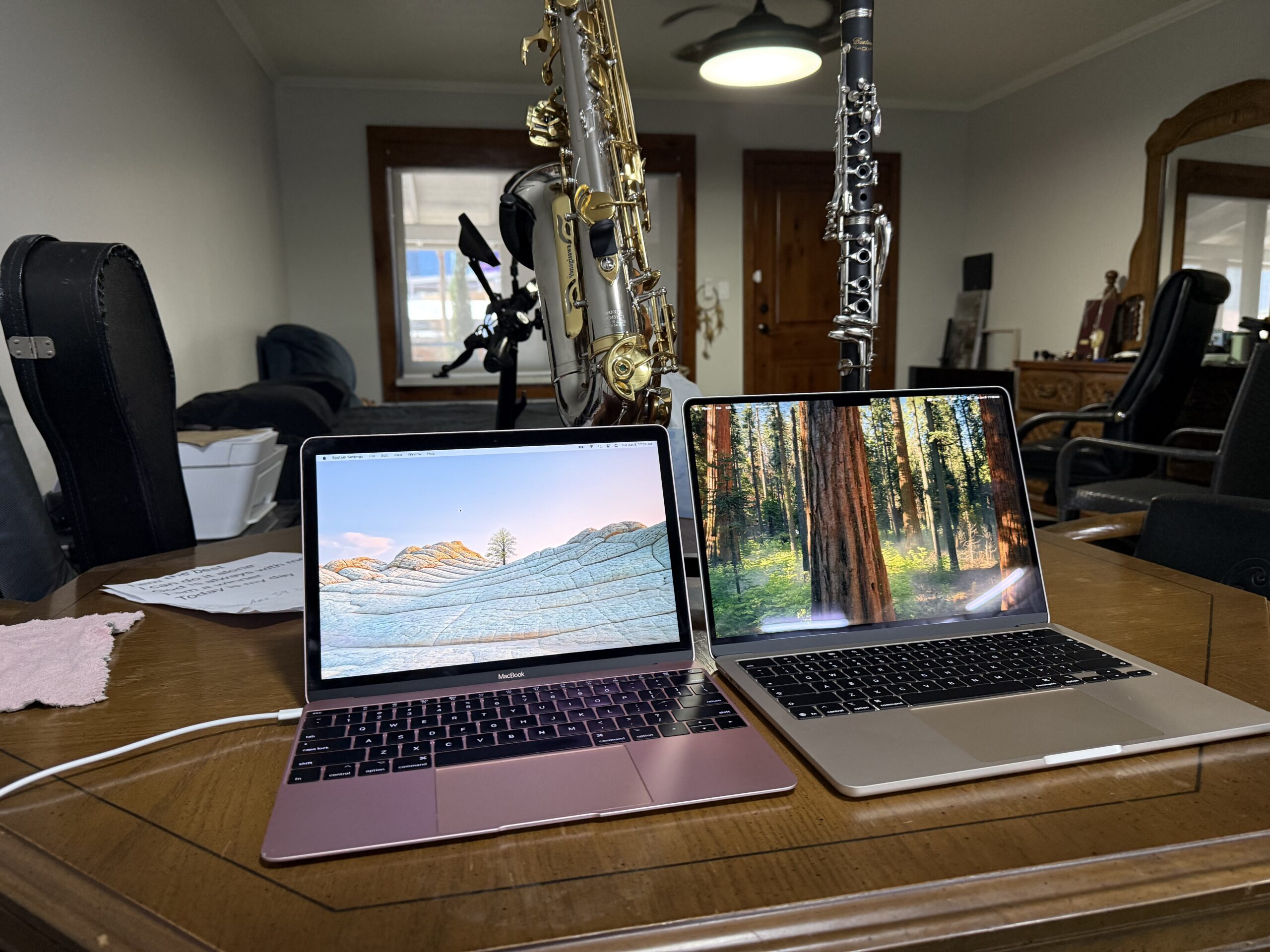 Dual Starlight 13-inch MacBook Air M5 laptops open on a desk